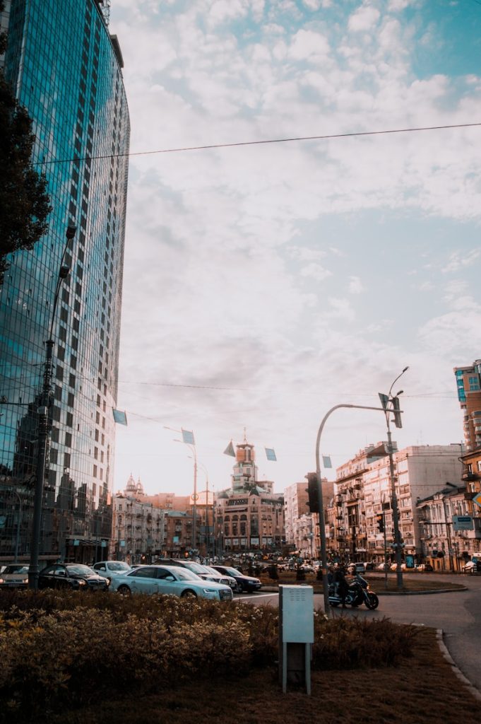 cars on road near buildings